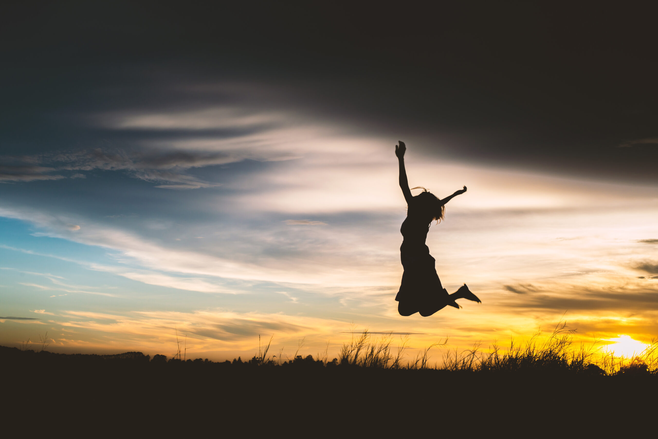 Silhouette of a beautiful girl jumping